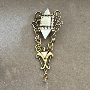Elegant Gold and White Filigree Brooch